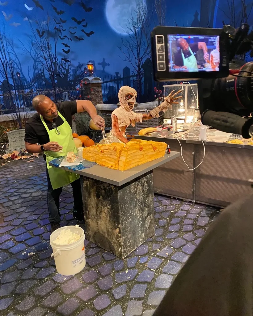 Reggie sculpting a mummy showpiece on the Halloween Wars set